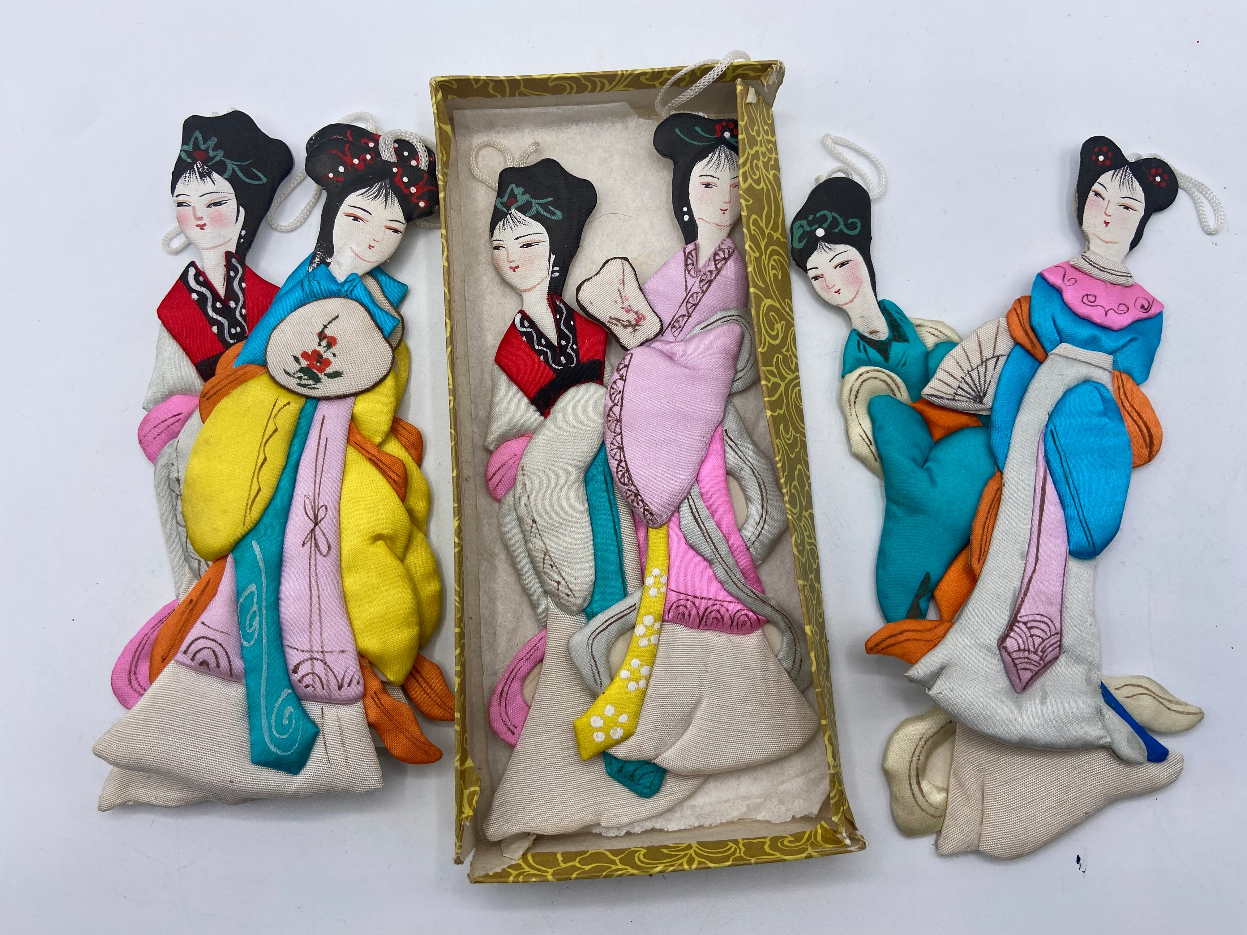 Oriental silk dolls